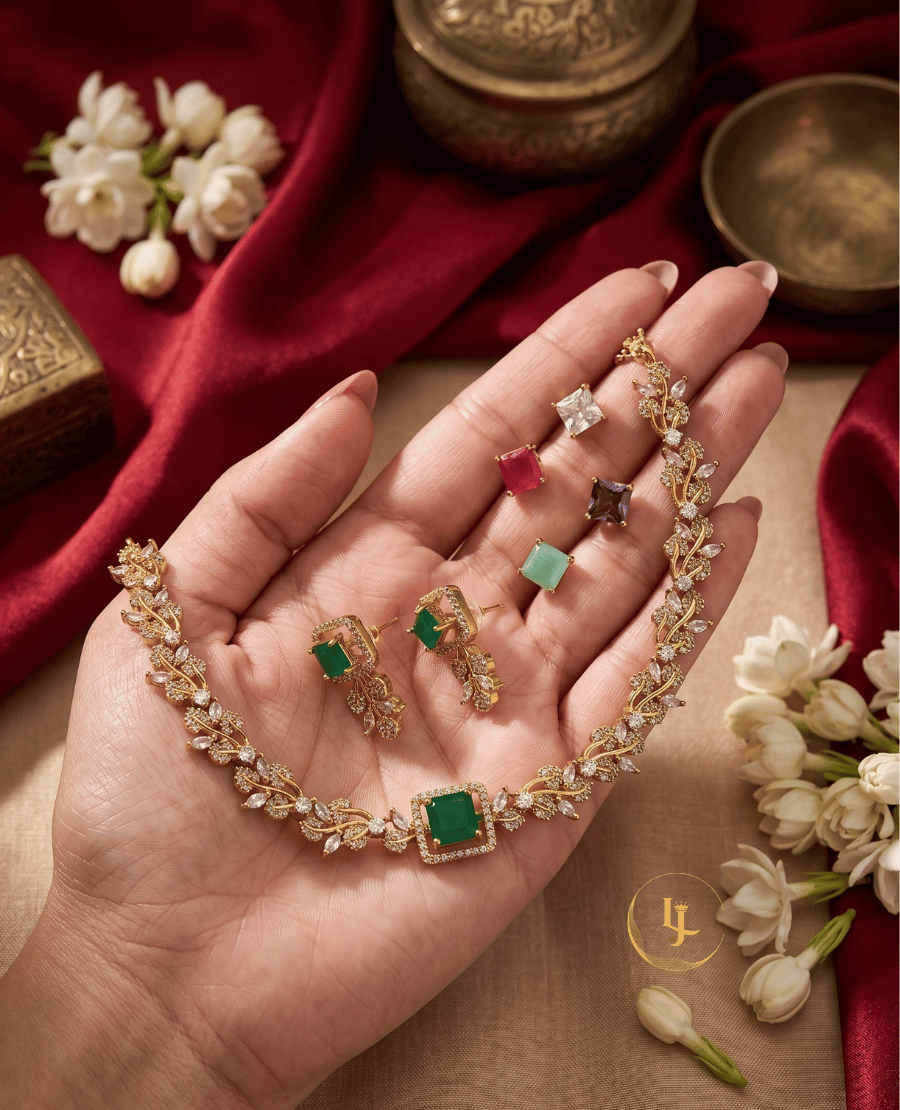 landmark-jewels-interchangeable-jewelry-set-held-in-hand-showing-various-colored-square-gemstones-including-ruby-mint-and-white