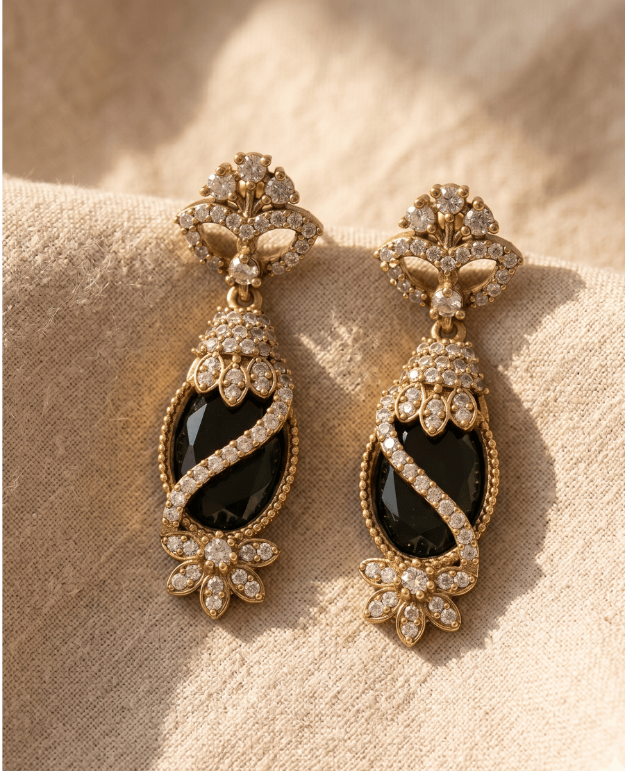 landmark-jewels-regal-long-drop-earrings-featuring-a-prominent-oval-black-stone-wrapped-in-a-winding-band-of-white-pave-crystals