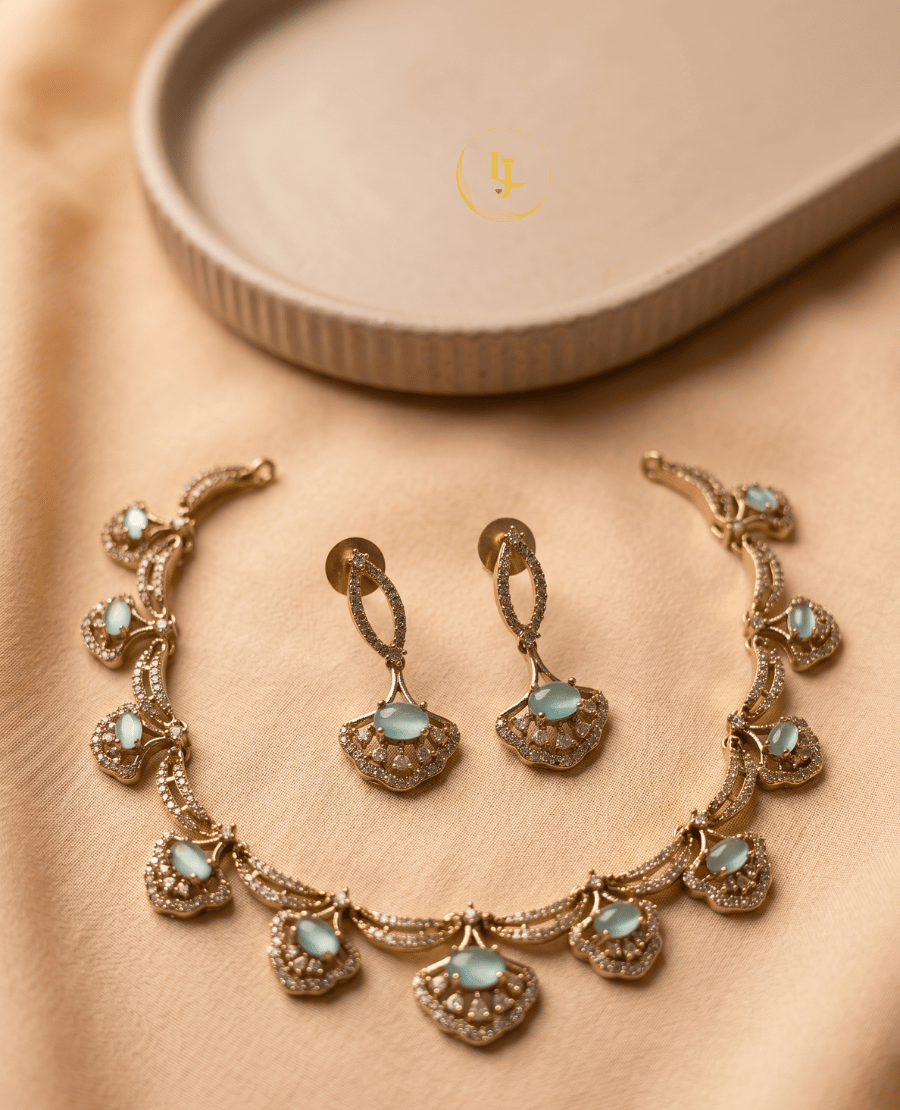 landmark-jewels-rose-gold-imitation-jewelry-set-with-mint-green-stones-and-cz-crystals-displayed-on-a-beige-fabric-background