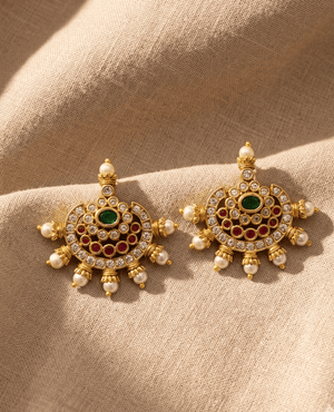 Landmark Jewels semi-circular multi-stone gold-plated stud earrings with red, green, and clear stones finished with a pearl border.