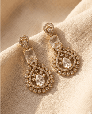 Geometric Art Deco style long earrings from Landmark Jewels featuring clear rectangular and teardrop crystals set in gold borders.