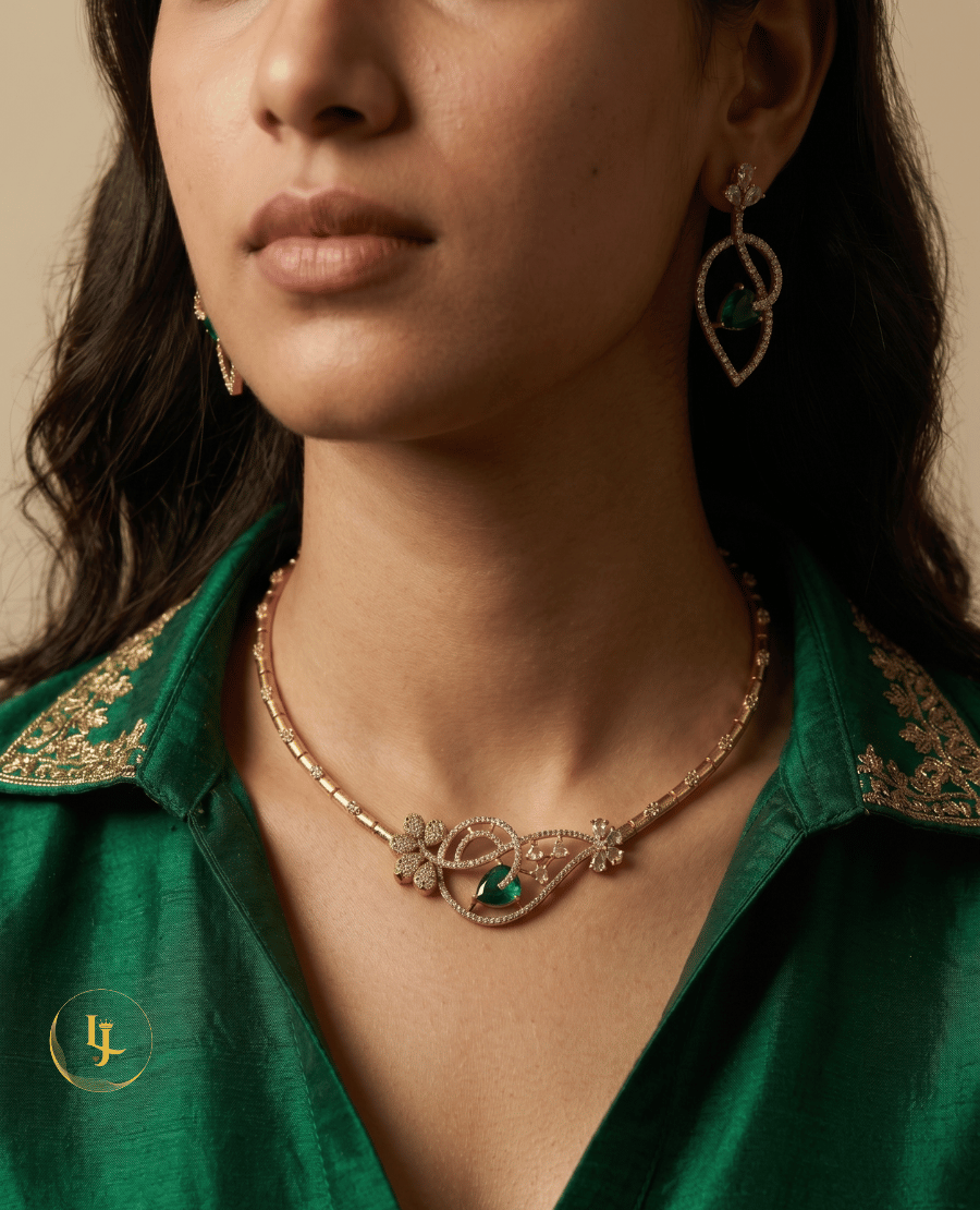 model-wearing-landmark-jewels-gold-plated-emerald-necklace-and-earrings-set-with-a-green-silk-saree