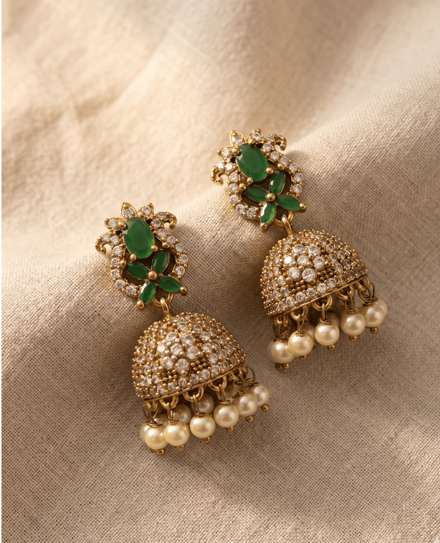 exquisite-gold-temple-jhumka-earrings-with-emerald-green-floral-accents-and-clear-crystal-encrusted-domes-finished-with-white-hanging-pearls