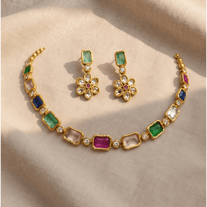 Gold choker featuring multicolored rectangular and square Monalisa stones, paired with matching floral cluster earrings featuring central green and pink stones.