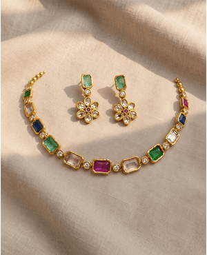 Gold choker featuring multicolored rectangular and square Monalisa stones, paired with matching floral cluster earrings featuring central green and pink stones.