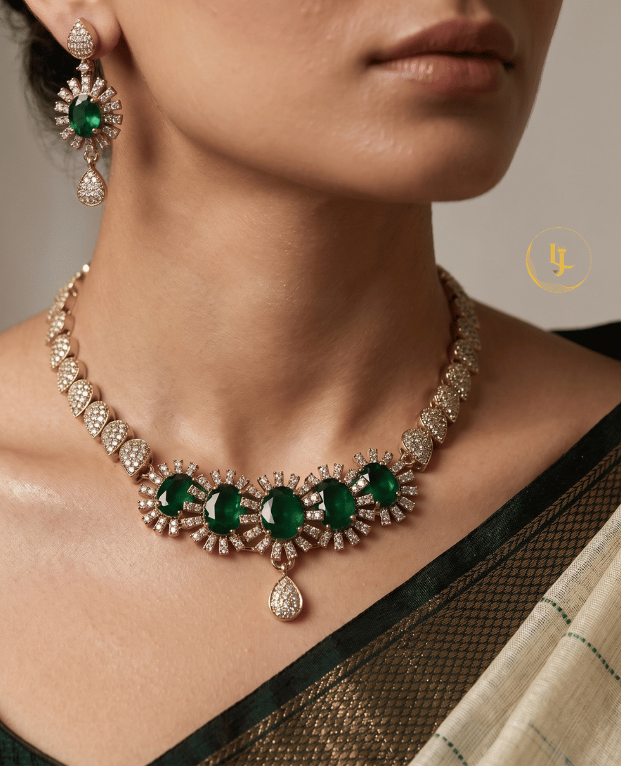 close-up-of-a-model-wearing-landmark-jewels-emerald-sunburst-choker-and-matching-earrings-with-a-traditional-saree
