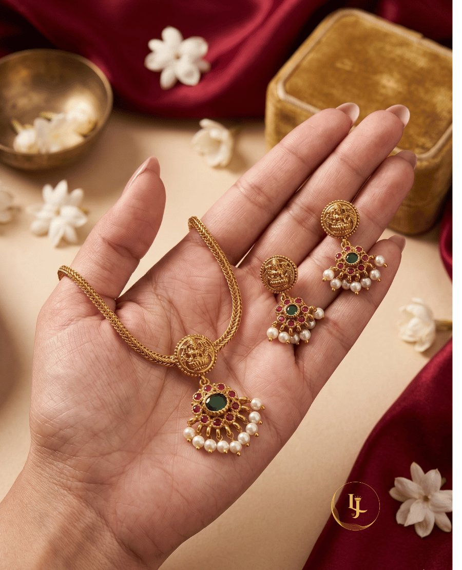 landmark-jewels-gold-plated-temple-jewelry-set-held-in-hand-showing-the-scale-and-intricate-goddess-lakshmi-engraving