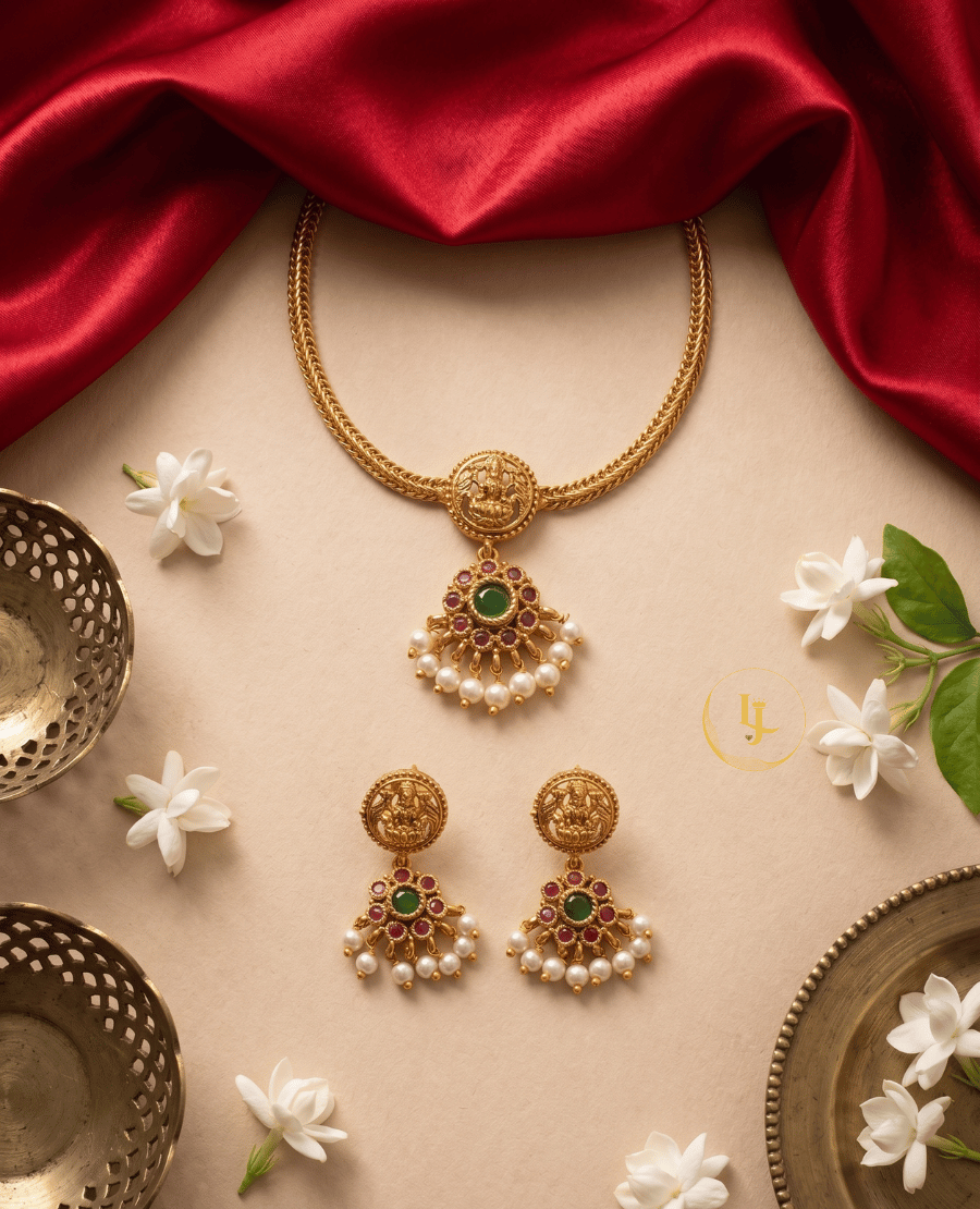 traditional-flat-lay-of-landmark-jewels-temple-necklace-and-earrings-set-with-jasmine-flowers-and-red-silk-fabric-background