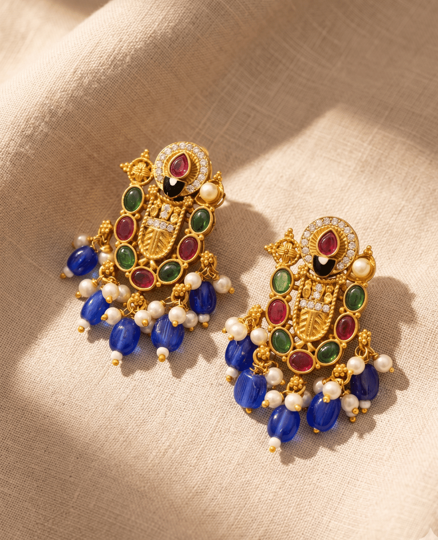 intricate-multi-color-imitation-gold-earrings-by-landmark-jewels-featuring-green-red-and-black-stonework-with-hanging-royal-blue-and-white-bead-drops