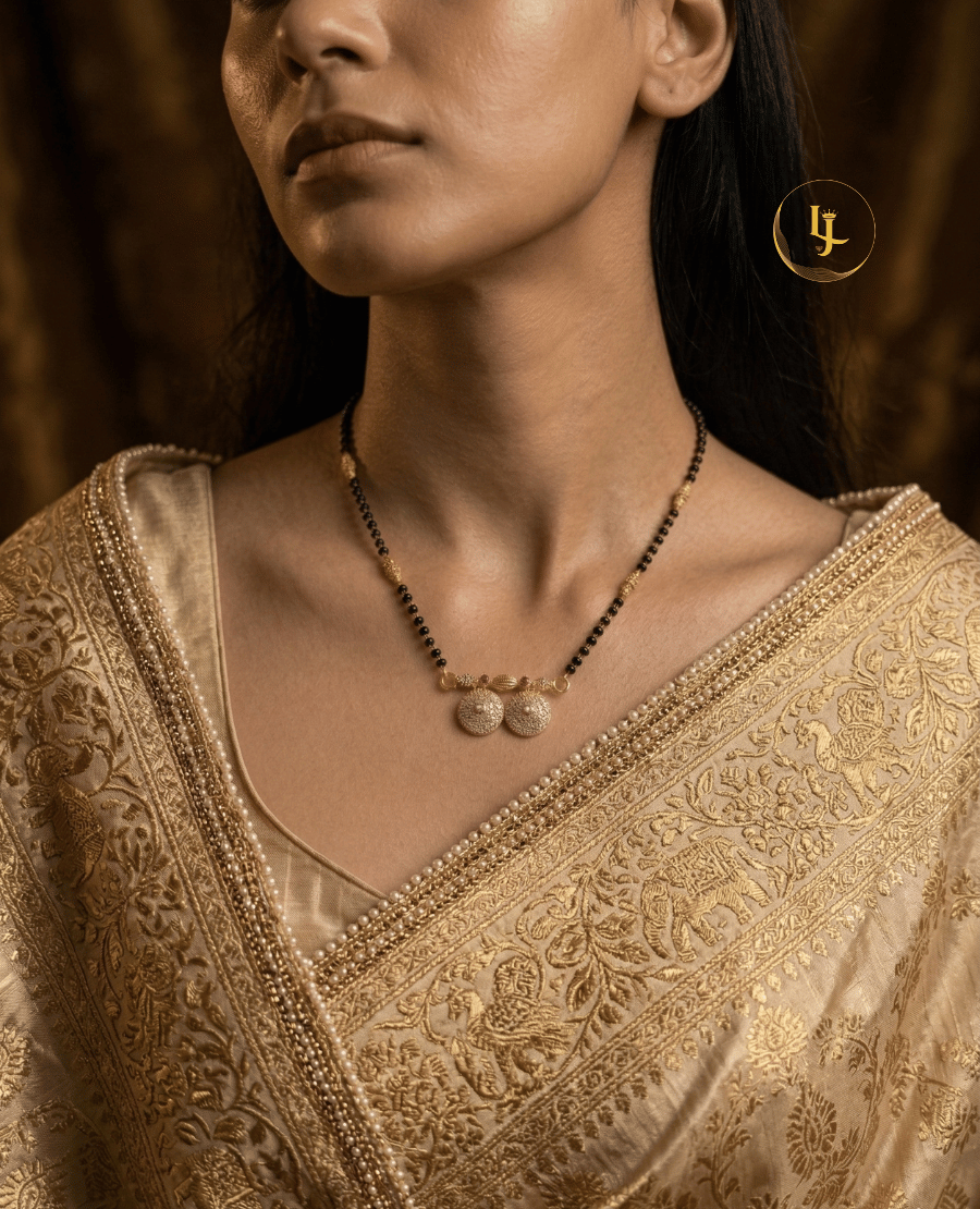 landmark-jewels-traditional-gold-plated-mangalsutra-with-black-beads-and-dual-diamond-studded-circular-pendant-on-a-beige-floral-background