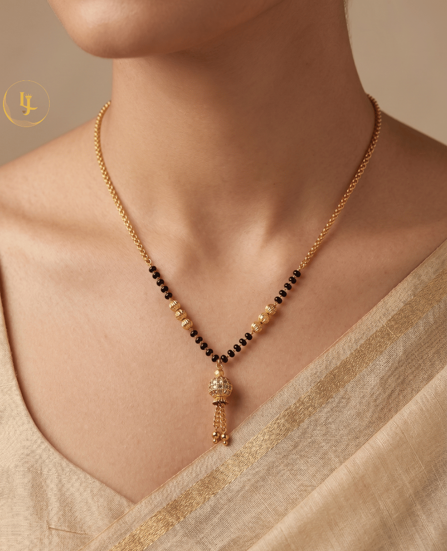 landmark-jewels-modern-gold-plated-mangalsutra-featuring-a-stone-studded-globe-pendant-with-gold-tassels-and-a-delicate-black-bead-chain