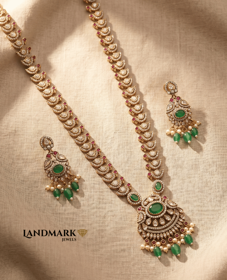 exquisite-antique-gold-plated-long-necklace-and-earring-set-featuring-white-polki-stones-emerald-green-centerpieces-and-pearl-hangings-by-landmark-jewels