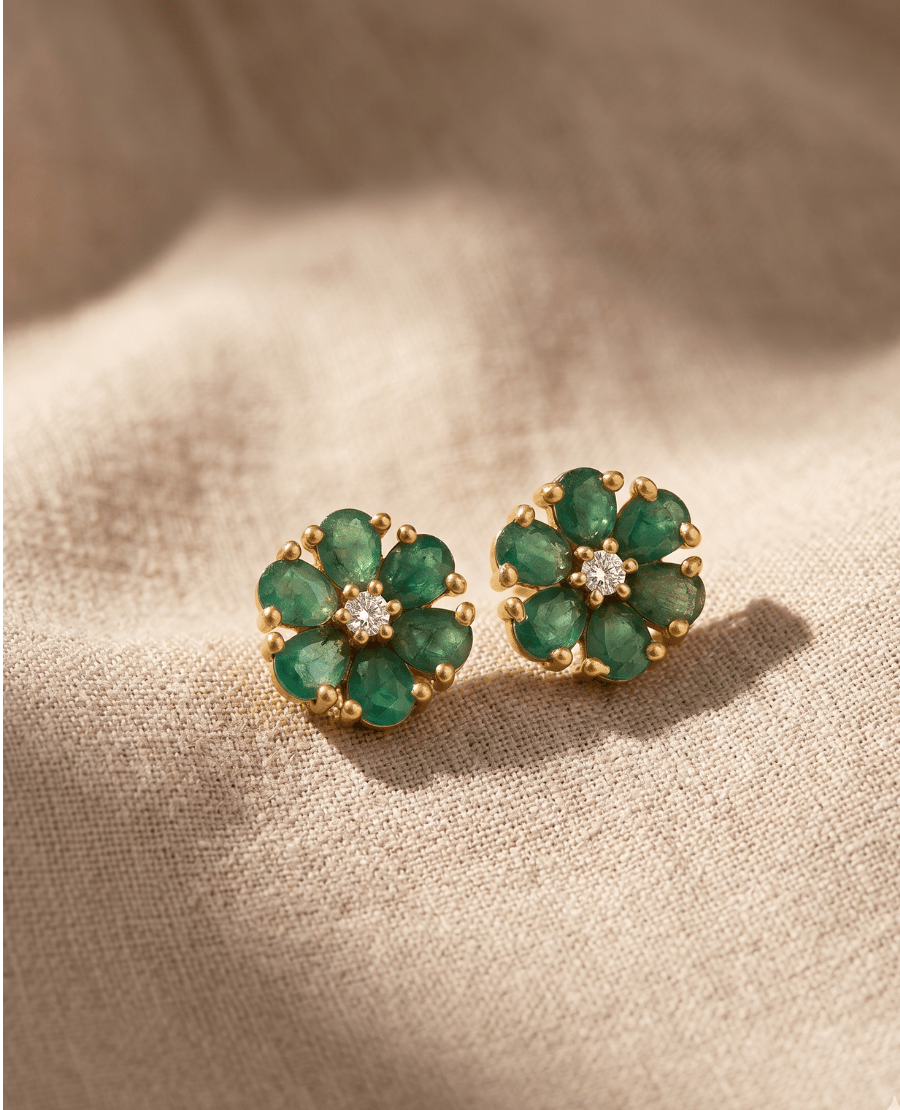 landmark-jewels-dainty-gold-flower-stud-earrings-showcasing-green-faux-emerald-petals-and-a-single-central-clear-stone-crystal