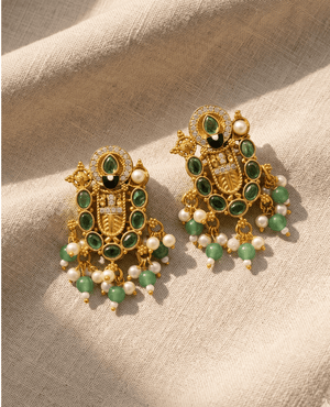 Detailed antique gold-plated earrings from Landmark Jewels featuring rich green stones and a playful fringe of mint green and white pearls