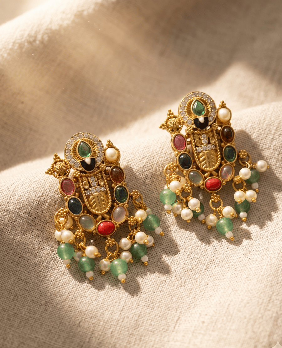 intricate-antique-gold-plated-temple-style-earrings-adorned-with-green-red-brown-and-white-stones-and-beaded-drops