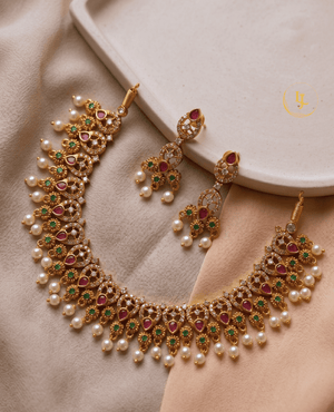 High-quality flat lay of Landmark Jewels traditional Indian jewelry set with pearls, rubies, and emeralds on a neutral aesthetic background.