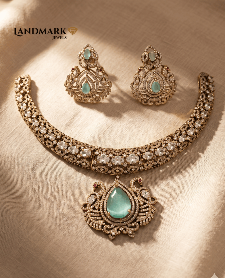 landmark-jewels-antique-gold-finish-necklace-and-earring-set-featuring-mint-green-pear-shaped-center-stones-and-white-polki-style-accents-on-a-textured-beige-background