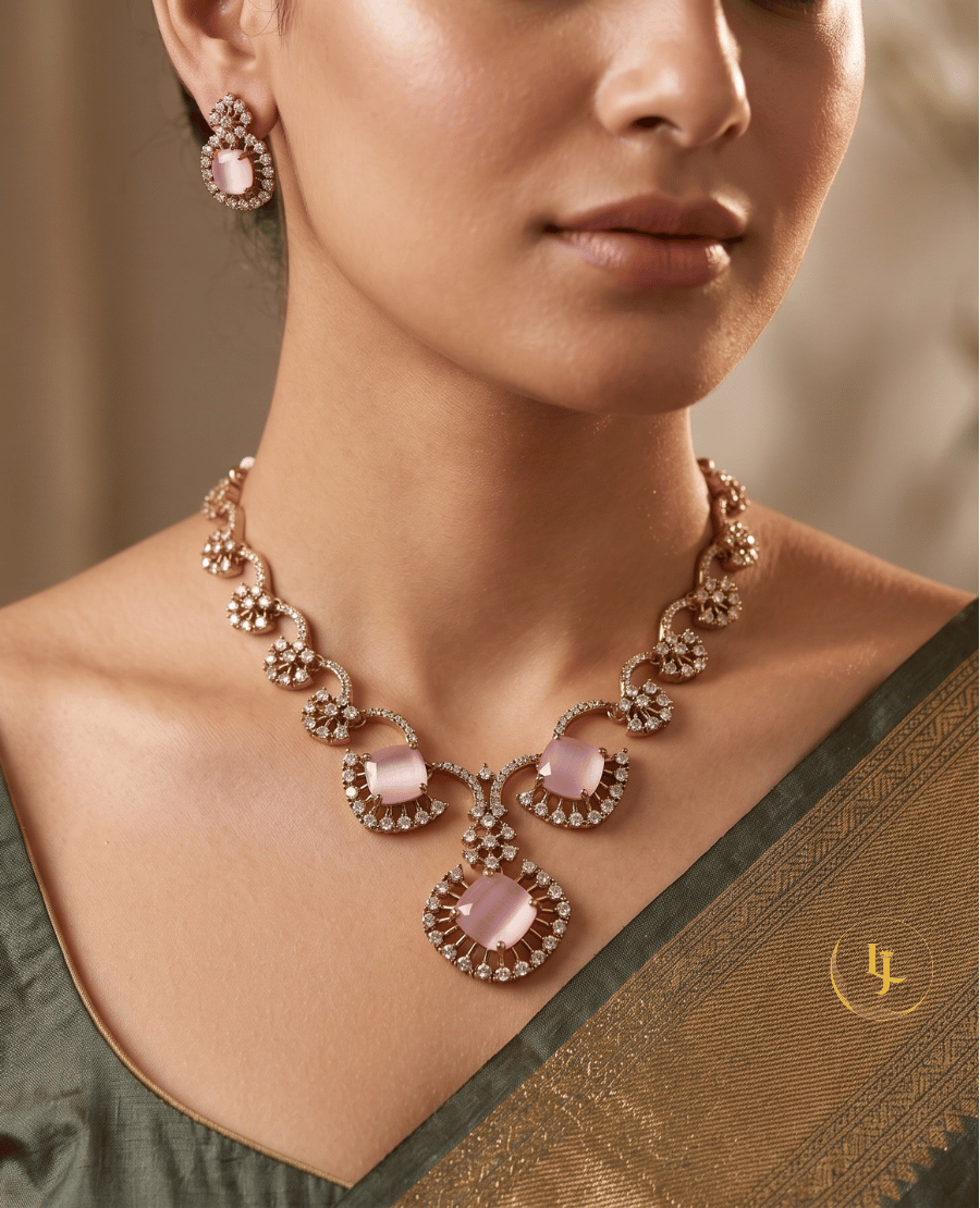 close-up-of-a-woman-wearing-the-landmark-jewels-rose-mist-necklace-and-earring-set-with-a-green-silk-saree