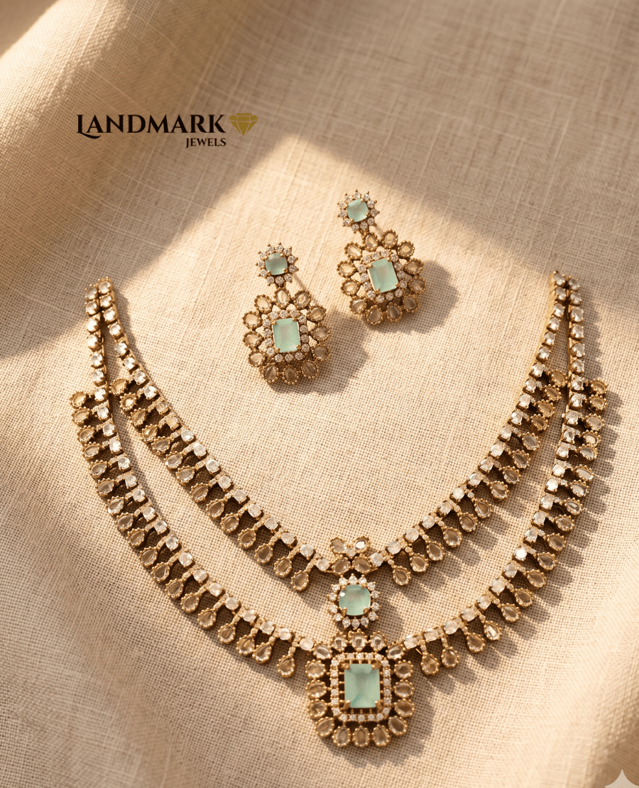 mint-green-stone-studded-two-layer-imitation-jewelry-necklace-and-matching-floral-drop-earrings-by-landmark-jewels-on-a-beige-textured-fabric