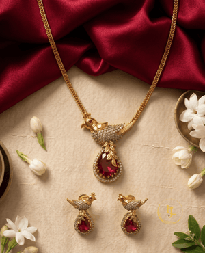 Traditional bird design imitation jewelry set with ruby stones and white crystals.