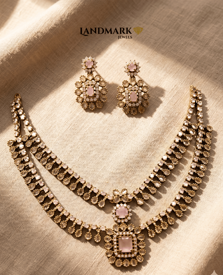 double-layered-antique-gold-necklace-set-featuring-rose-pink-rectangular-stones-and-polki-style-crystal-embellishments-with-matching-floral-drop-earrings-by-landmark-jewels