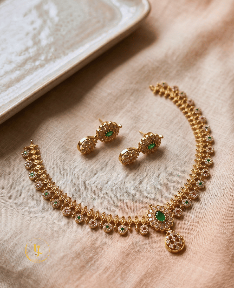 high-angle-flat-lay-of-the-emerald-ruby-duo-necklace-and-earring-set-on-a-neutral-fabric-background-highlighting-the-craftsmanship-of-landmark-jewels