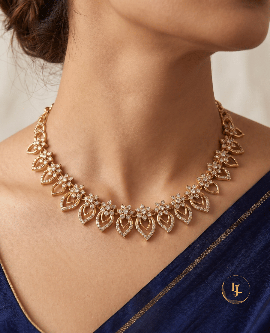close-up-of-a-woman-wearing-the-landmark-jewels-gold-plated-cz-floral-paisley-necklace-against-a-royal-blue-saree