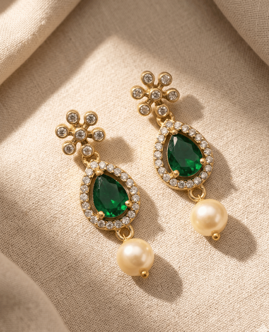 a-pair-of-gold-plated-drop-earrings-from-landmark-jewels-featuring-a-floral-cz-top-pear-shaped-green-emerald-stone-surrounded-by-crystals-and-a-bottom-pearl-bead