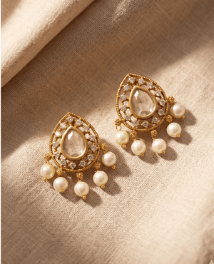 Pair of traditional gold-toned tear-drop stud earrings by Landmark Jewels featuring a central clear stone, crystal halo, and five small hanging pearls at the bottom.