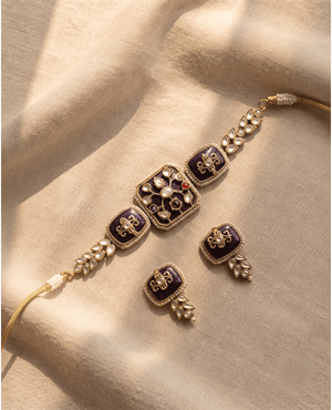 Royal purple enamel and gold choker necklace with intricate white Polki motifs and matching square earrings.