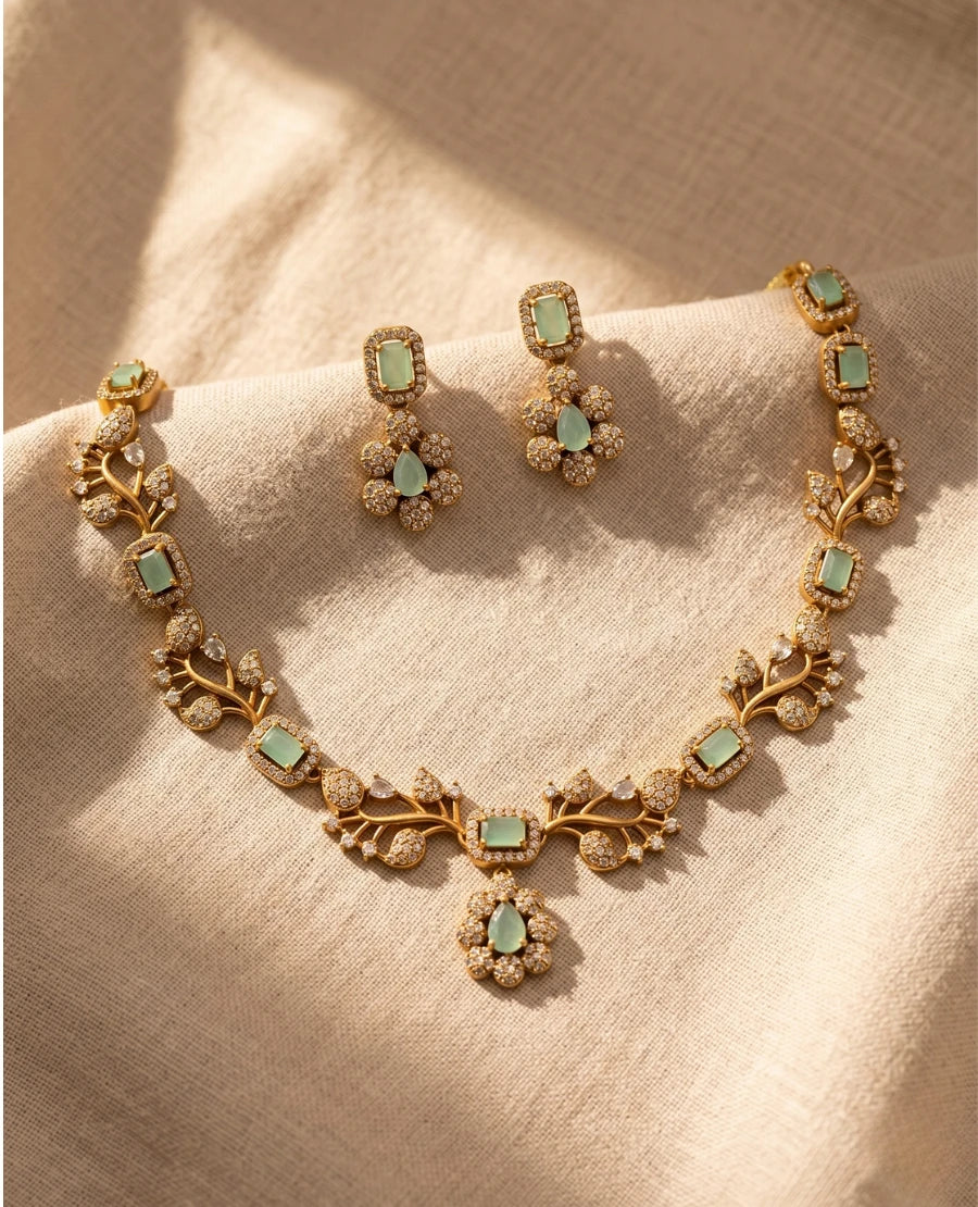 gold-plated-pastel-mint-green-american-diamond-leaf-necklace-set-with-matching-earrings