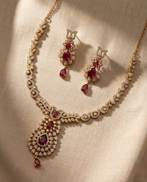 Statement gold plated ruby red American diamond bridal necklace set with long drop earrings