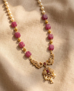 Gold plated pink quartz and pearl beaded necklace with peacock temple pendant