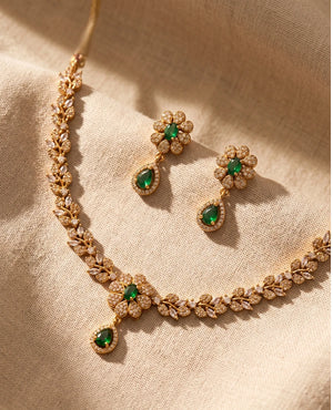 Emerald green floral CZ gold plated leaf design necklace set with matching drop earrings