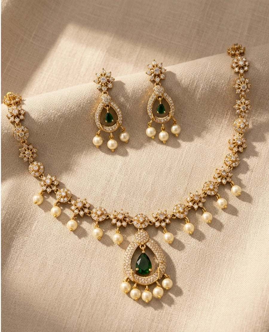 gold-plated-american-diamond-floral-necklace-with-green-teardrop-pendant-pearl-drops-and-matching-earrings
