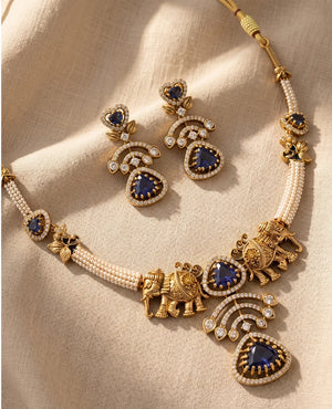 Antique gold temple necklace with elephant motifs blue stones and pearls with matching earrings