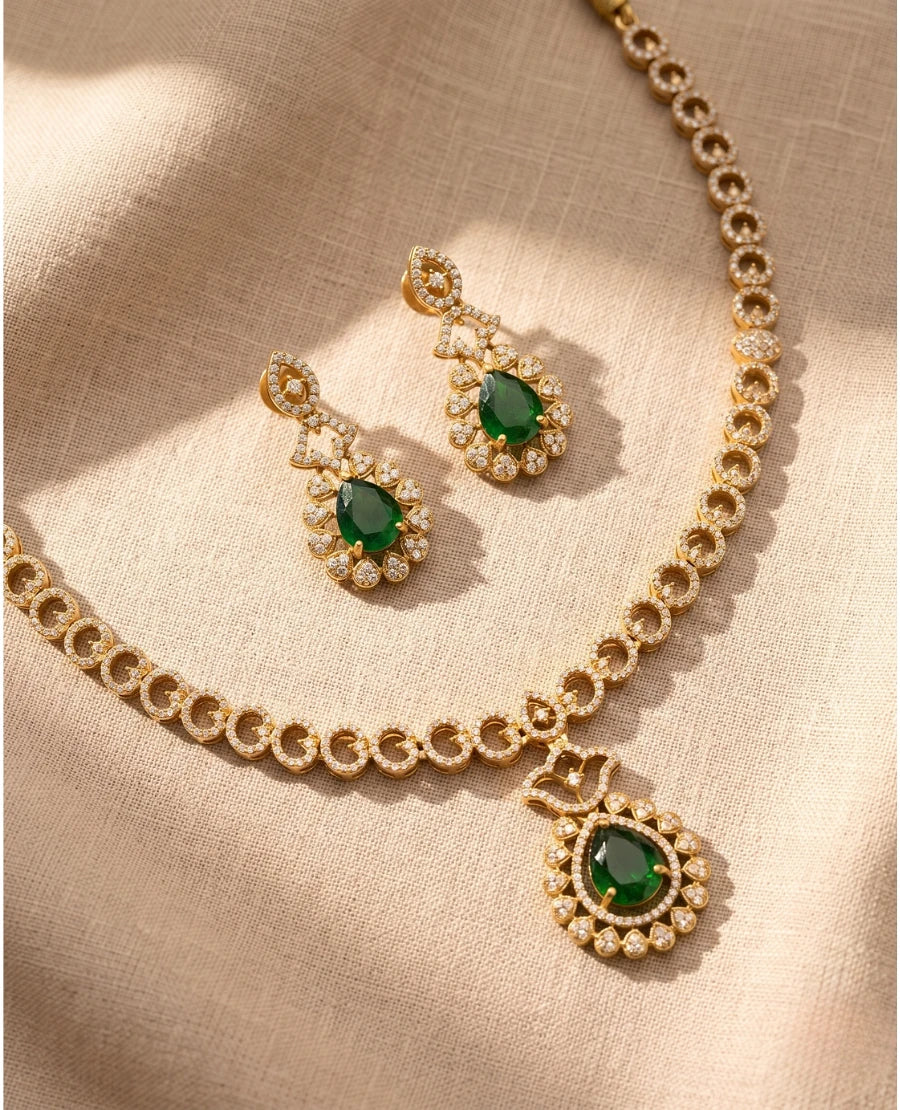gold-plated-cz-necklace-with-emerald-green-teardrop-pendant-and-matching-green-stone-earrings