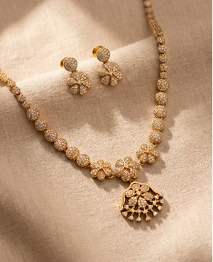 Gold plated American diamond floral necklace set with pavé CZ stones and matching flower earrings