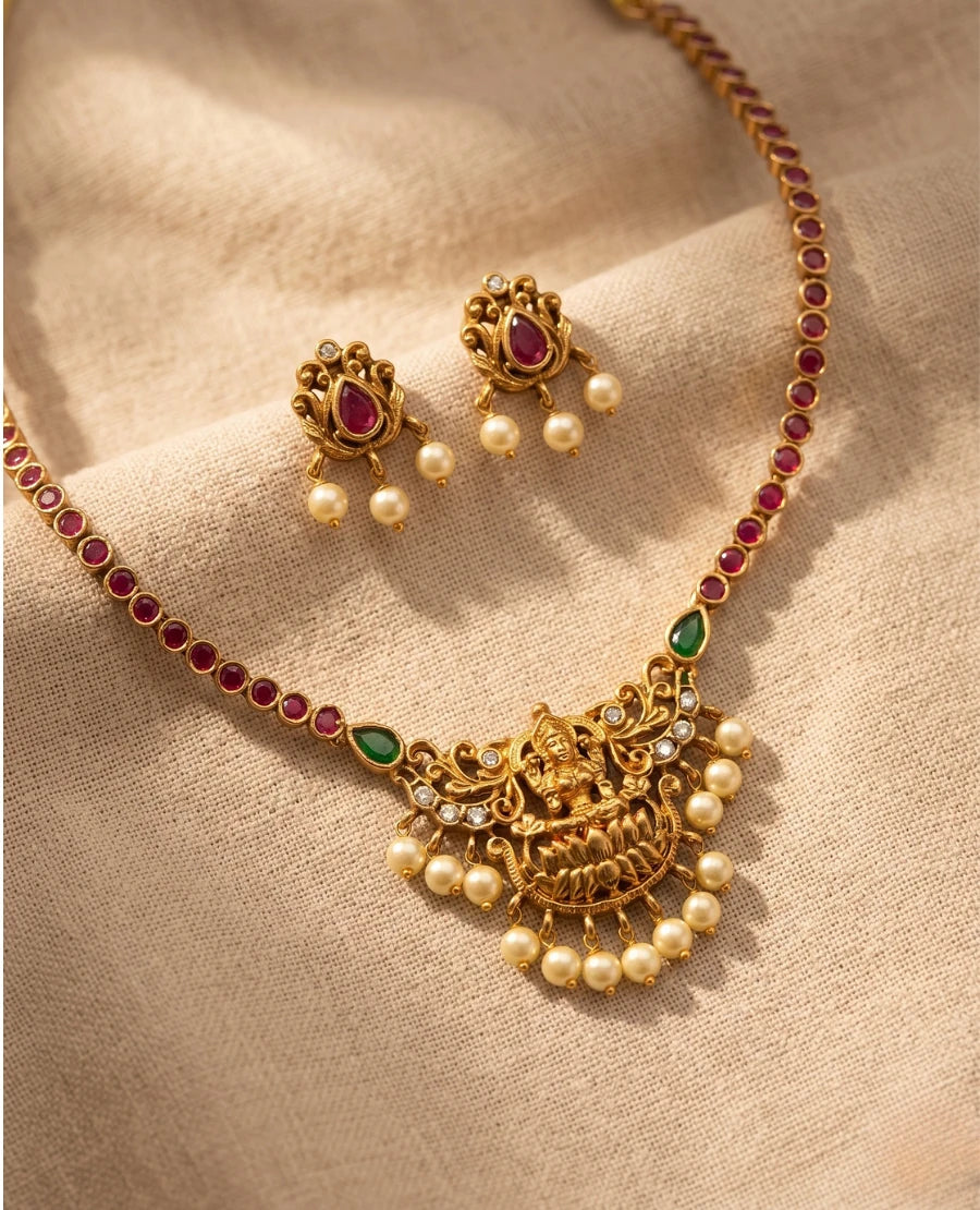 antique-gold-lakshmi-temple-necklace-set-with-ruby-stones-pearls-and-matching-earrings