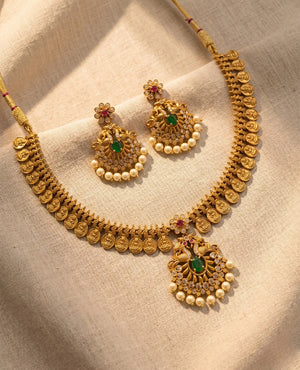 Antique gold Kasu coin temple necklace set with peacock pendant, pearls and matching jhumka earrings
