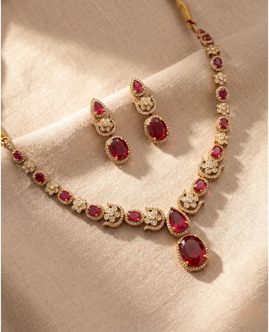 gold-plated-ruby-red-american-diamond-necklace-set-with-oval-stones-and-matching-earrings