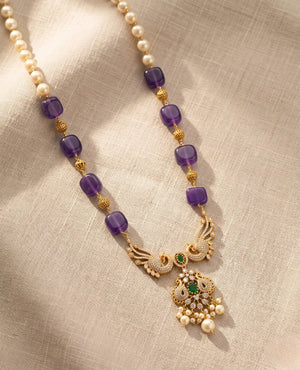 Gold plated temple necklace with purple amethyst beads pearls peacock pendant and green stones
