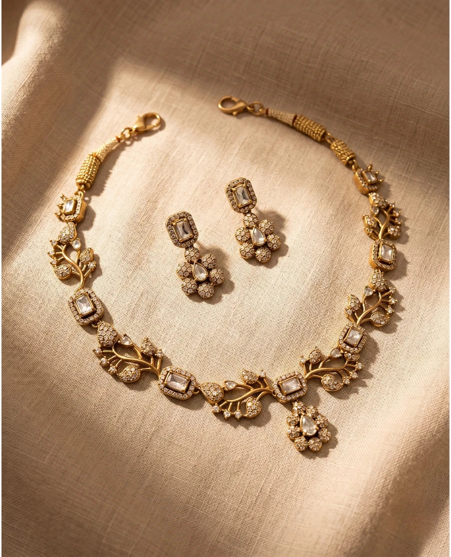 matte-gold-floral-vine-necklace-with-white-american-diamond-stones-and-matching-drop-earrings