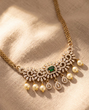 Gold plated choker necklace with emerald green centre stone, CZ diamonds and pearl drops