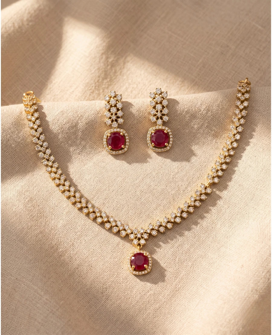 gold-plated-necklace-set-with-ruby-red-oval-pendant-american-diamonds-and-matching-drop-earrings
