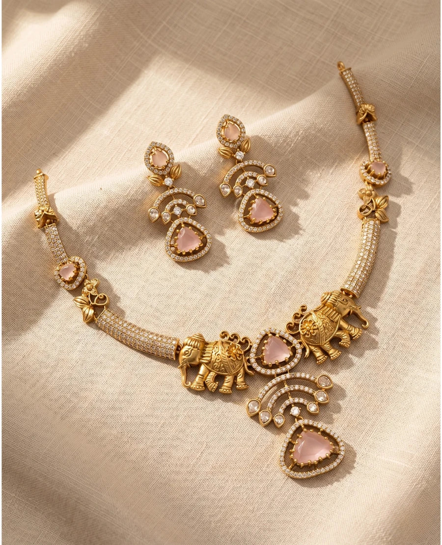 antique-gold-elephant-motif-necklace-with-blush-pink-stones-and-matching-ornate-earrings