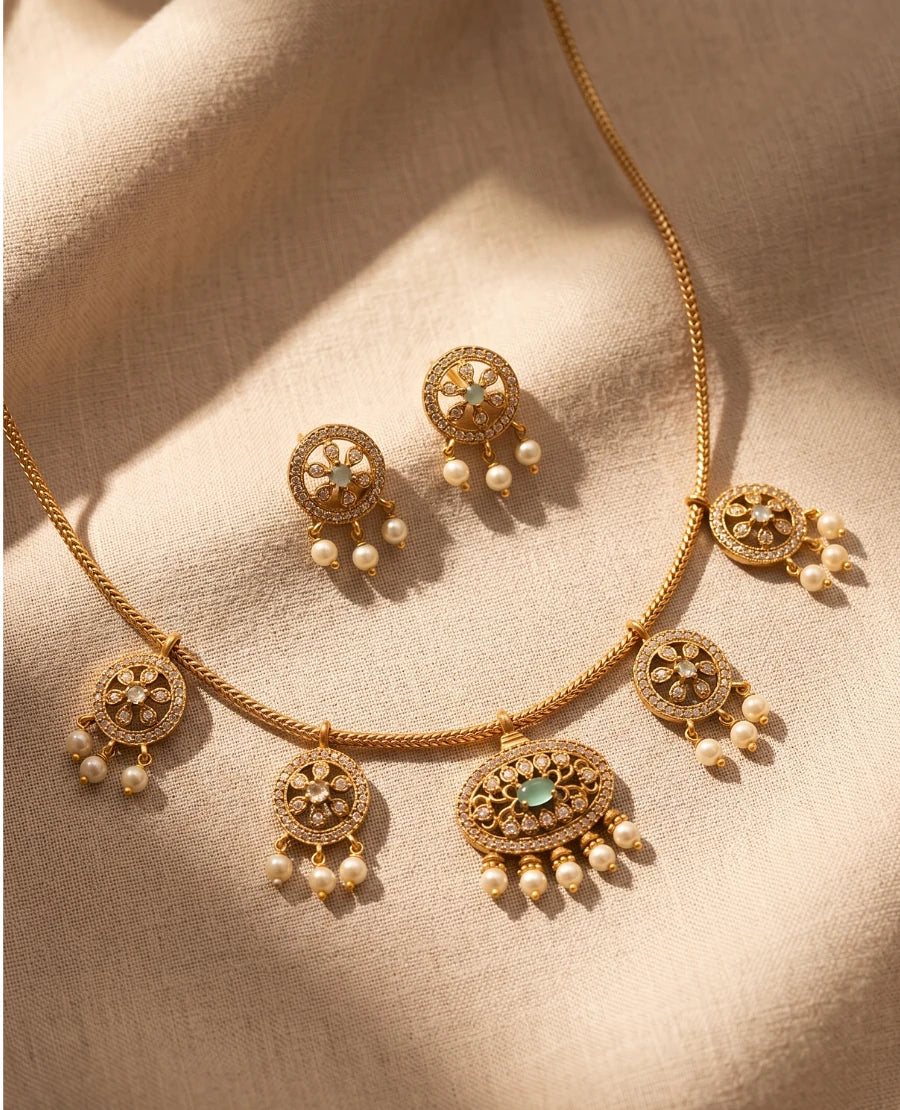 delicate-gold-plated-american-diamond-station-necklace-with-pearl-drops-and-mint-green-stone-earrings