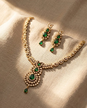 Royal gold plated emerald green American diamond teardrop pendant necklace set with earrings