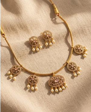 Gold plated blush pink CZ necklace set with pearl drop earrings and floral motifs