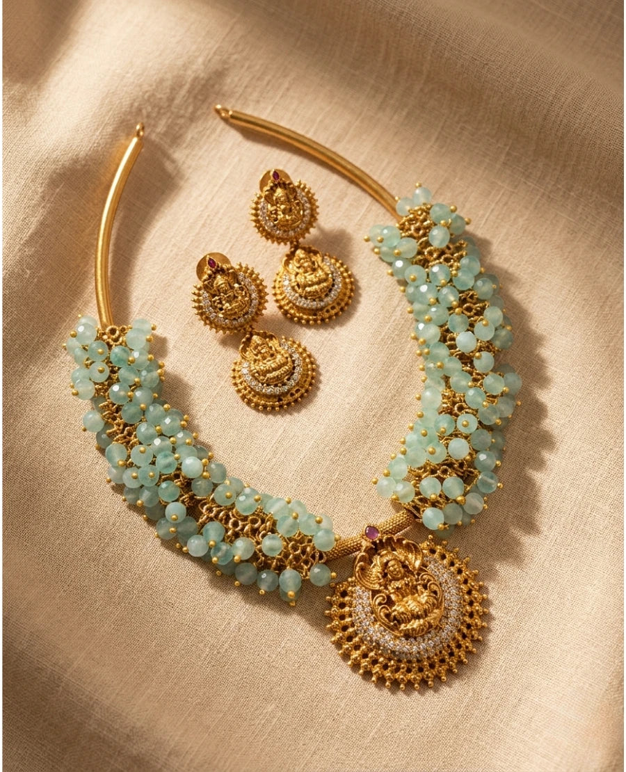 antique-gold-temple-lakshmi-choker-necklace-set-with-aqua-blue-beads-and-matching-jhumka-earrings